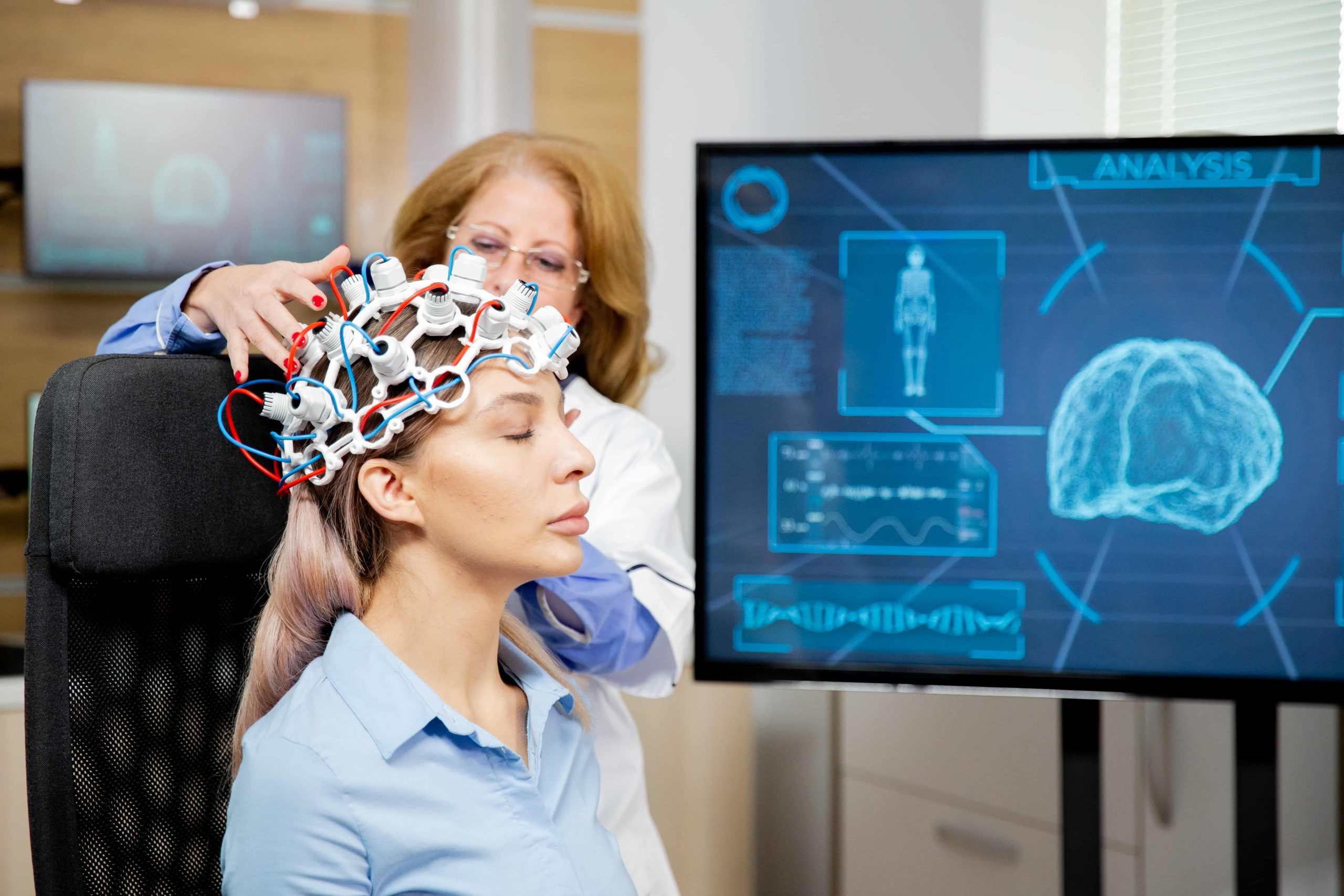 doctor-arranging-scanning-device-head-female-patient (1)